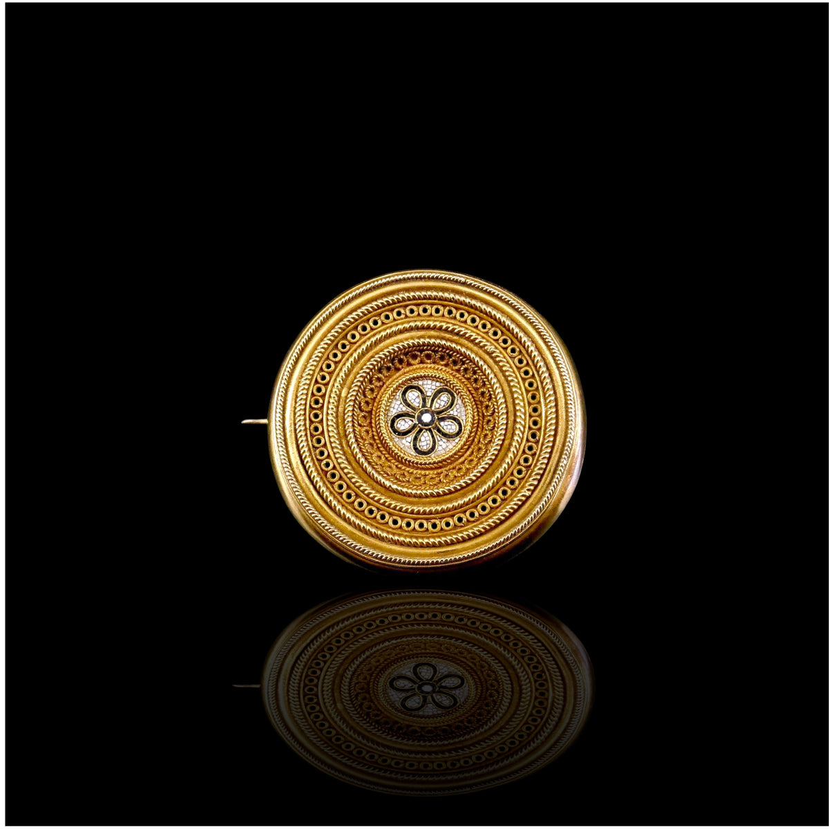 A Castellani floral micromosaic brooch, Rome, c.1870, combining finely worked gold with the celebrated archaeological revival style of the Roman house.